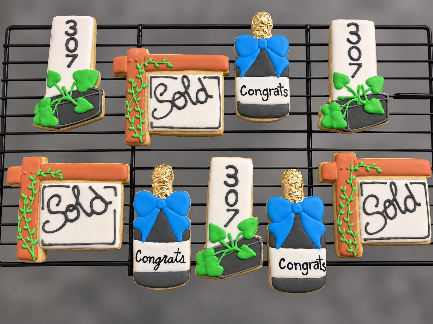 Decorated cookies in bottle, sign, and address shapes