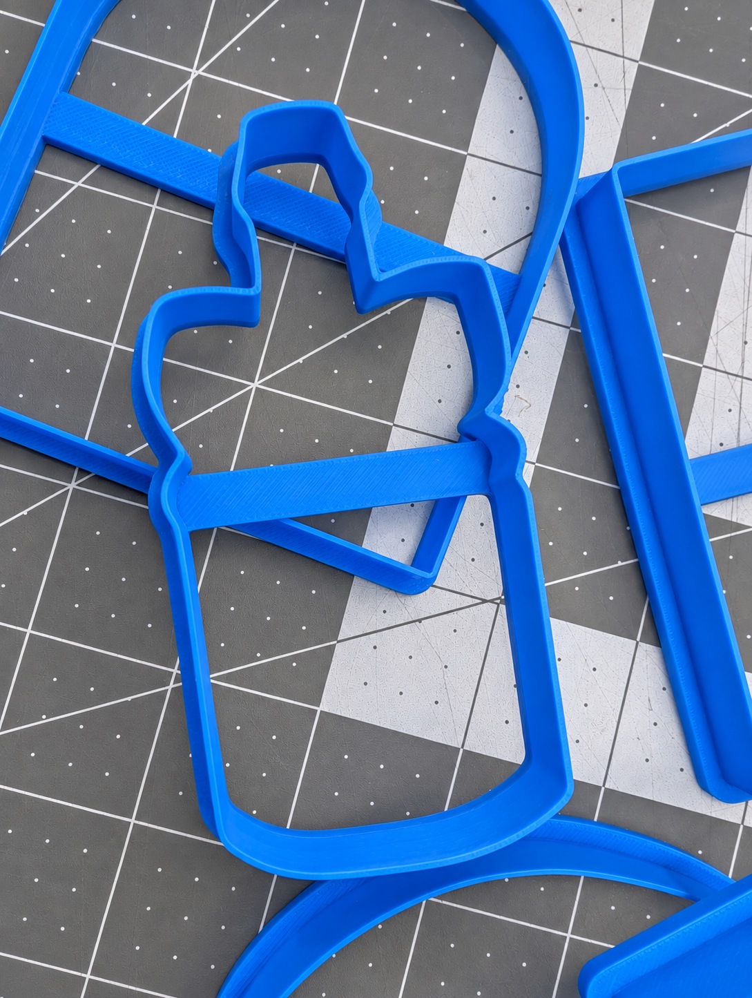 Close-up of a blue bottle-shaped printed cutter